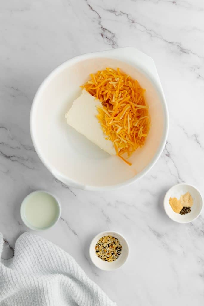 preparing the cheese for Pecan Bacon Cheeseball