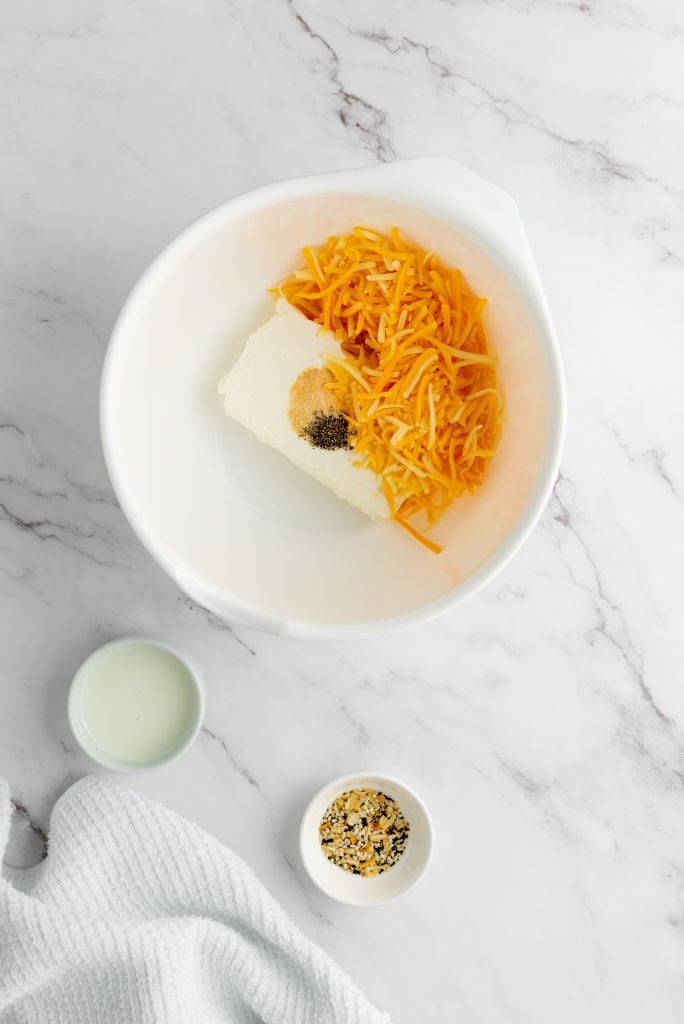preparing the cheese for Pecan Bacon Cheeseball