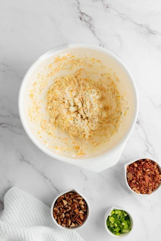 preparing the cheese for Pecan Bacon Cheeseball