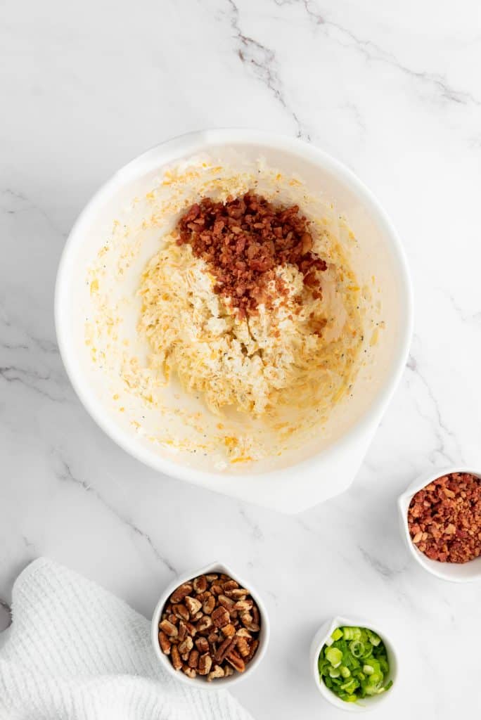 preparing the cheese for Pecan Bacon Cheeseball