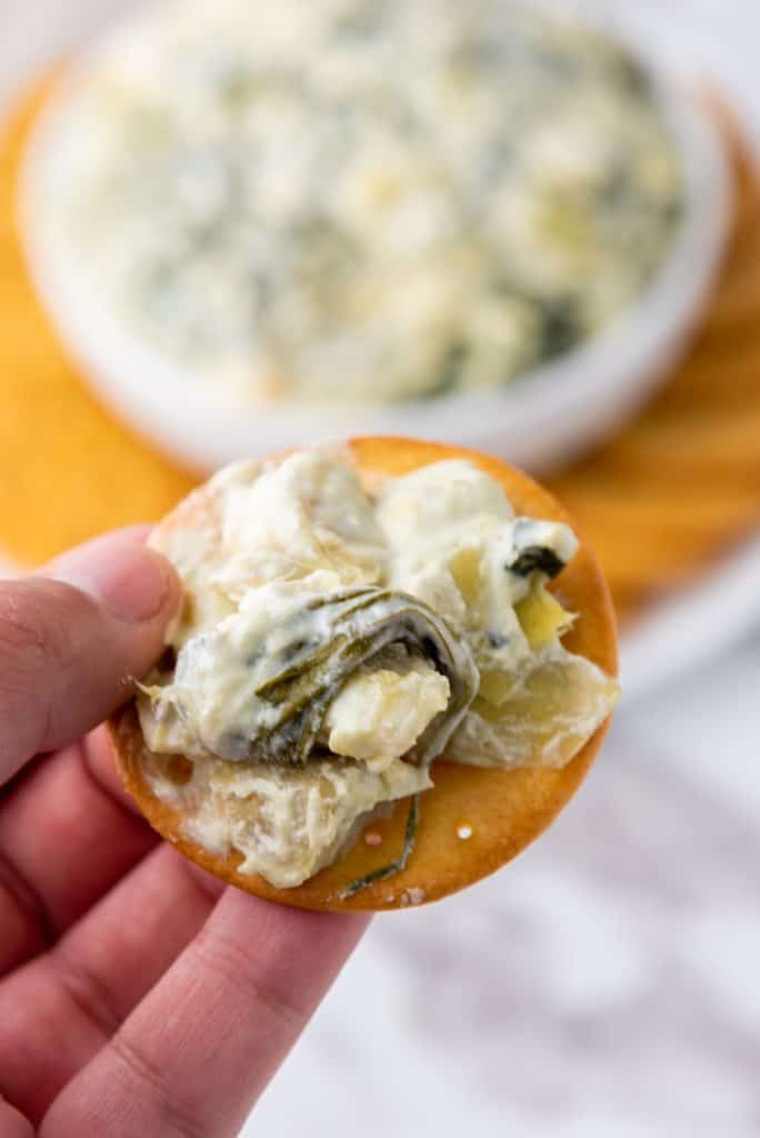 spinach artichoke dip on a cracker